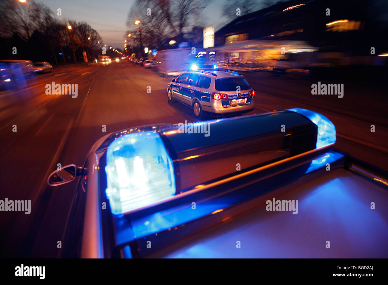patrol car of the police in operation with blue lights switched on and siren, Germany, Europe. Stock Photo