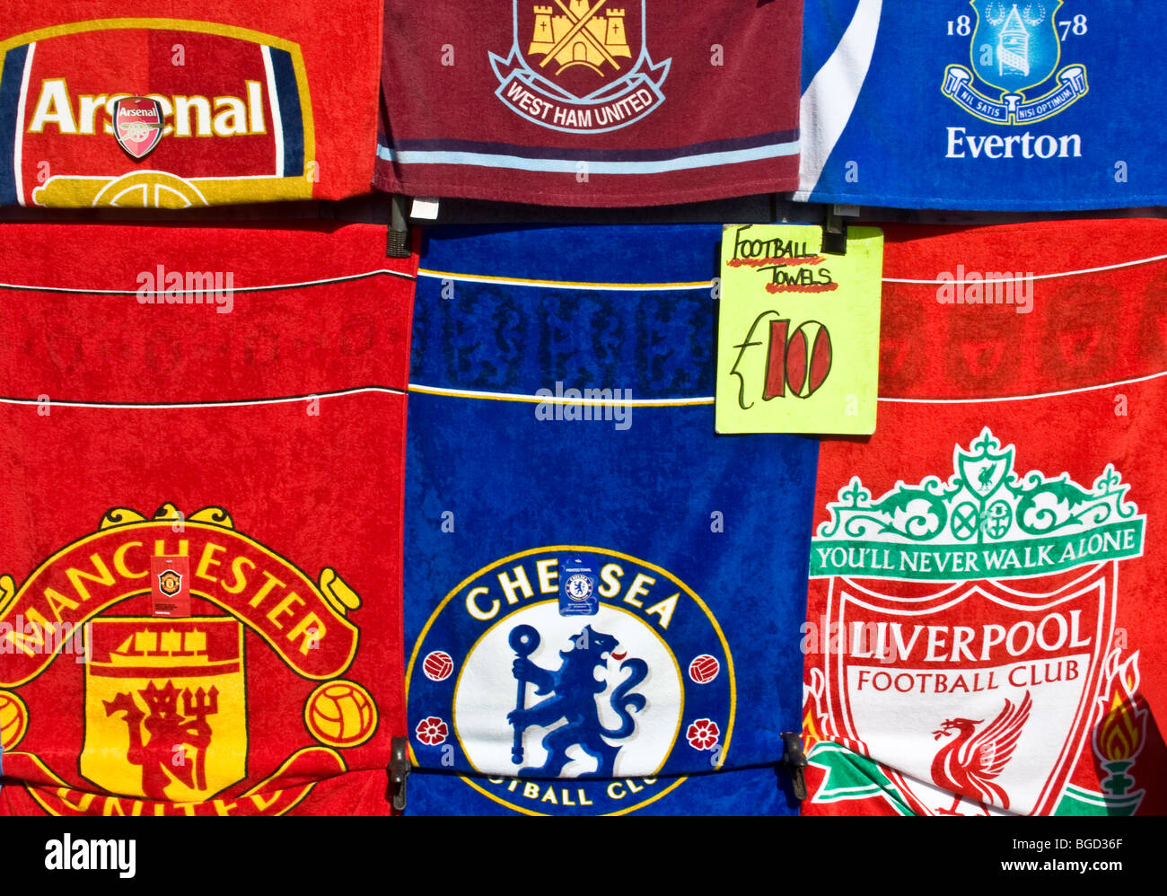 Football towels on sale at market stall, UK. Stock Photo