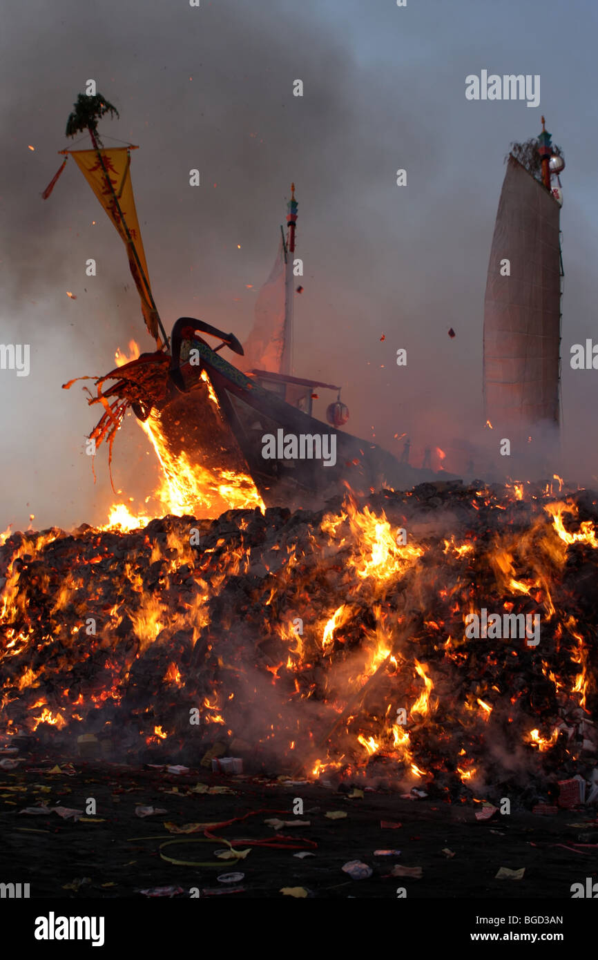 wood boat burning for a taiwanese festival Stock Photo