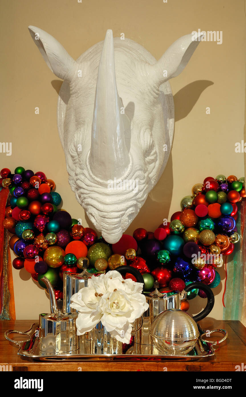 Colorful Christmas balls and a large plastic rhino head on a wall decorated for sale, Im Weller, Nuremberg, Middle Franconia, B Stock Photo