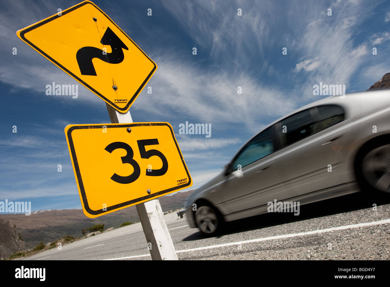 35kph sign on a twisty mountain road in New Zealand Stock Photo - Alamy