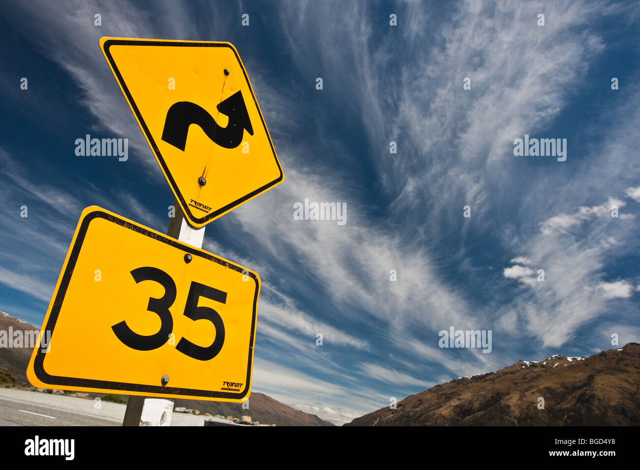 35kph sign on a twisty mountain road in New Zealand Stock Photo - Alamy