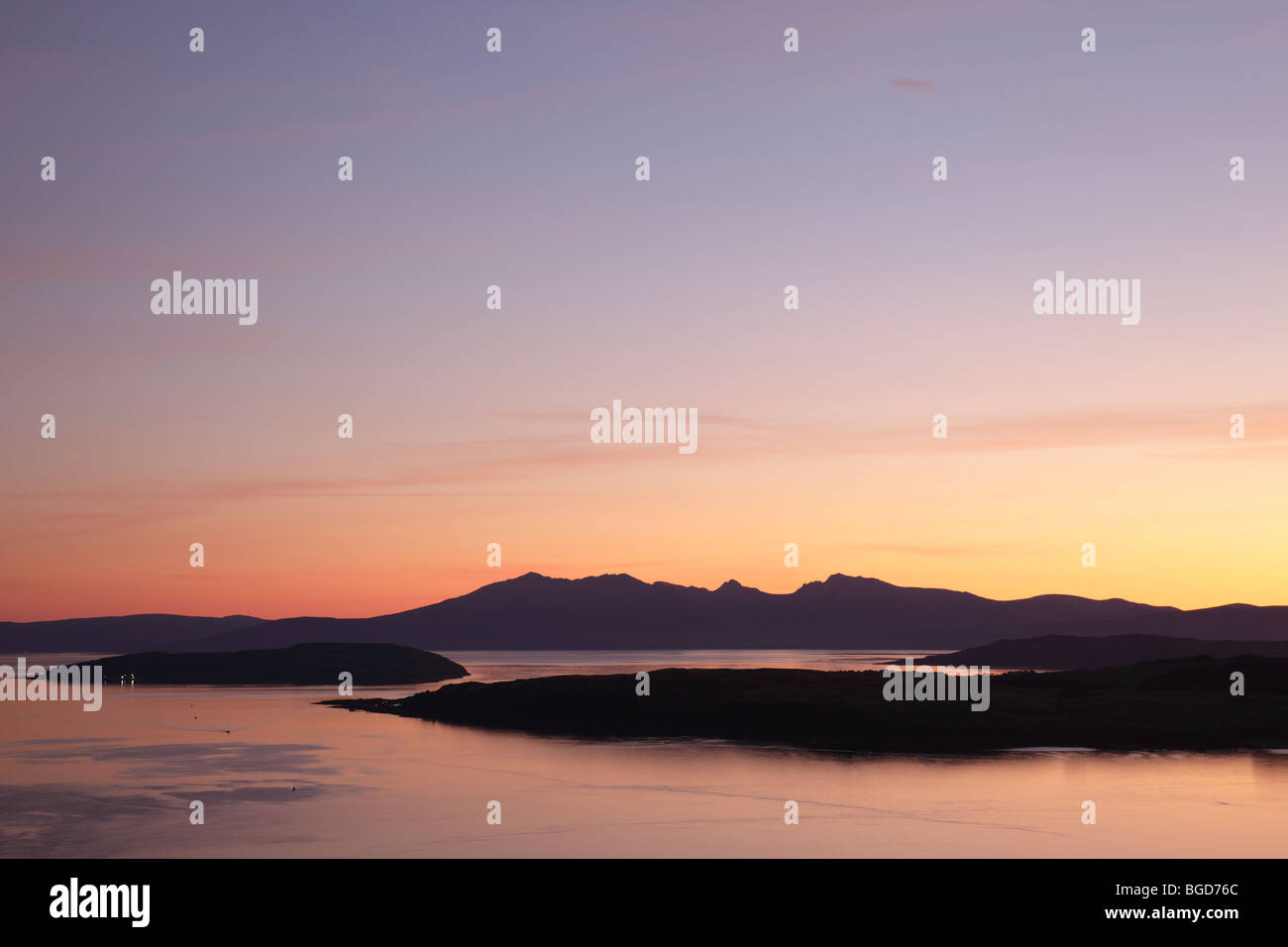 Sunset over the islands of Arran, Great Cumbrae and Little Cumbrae in the Firth of Clyde, North Ayrshire, Scotland, UK Stock Photo