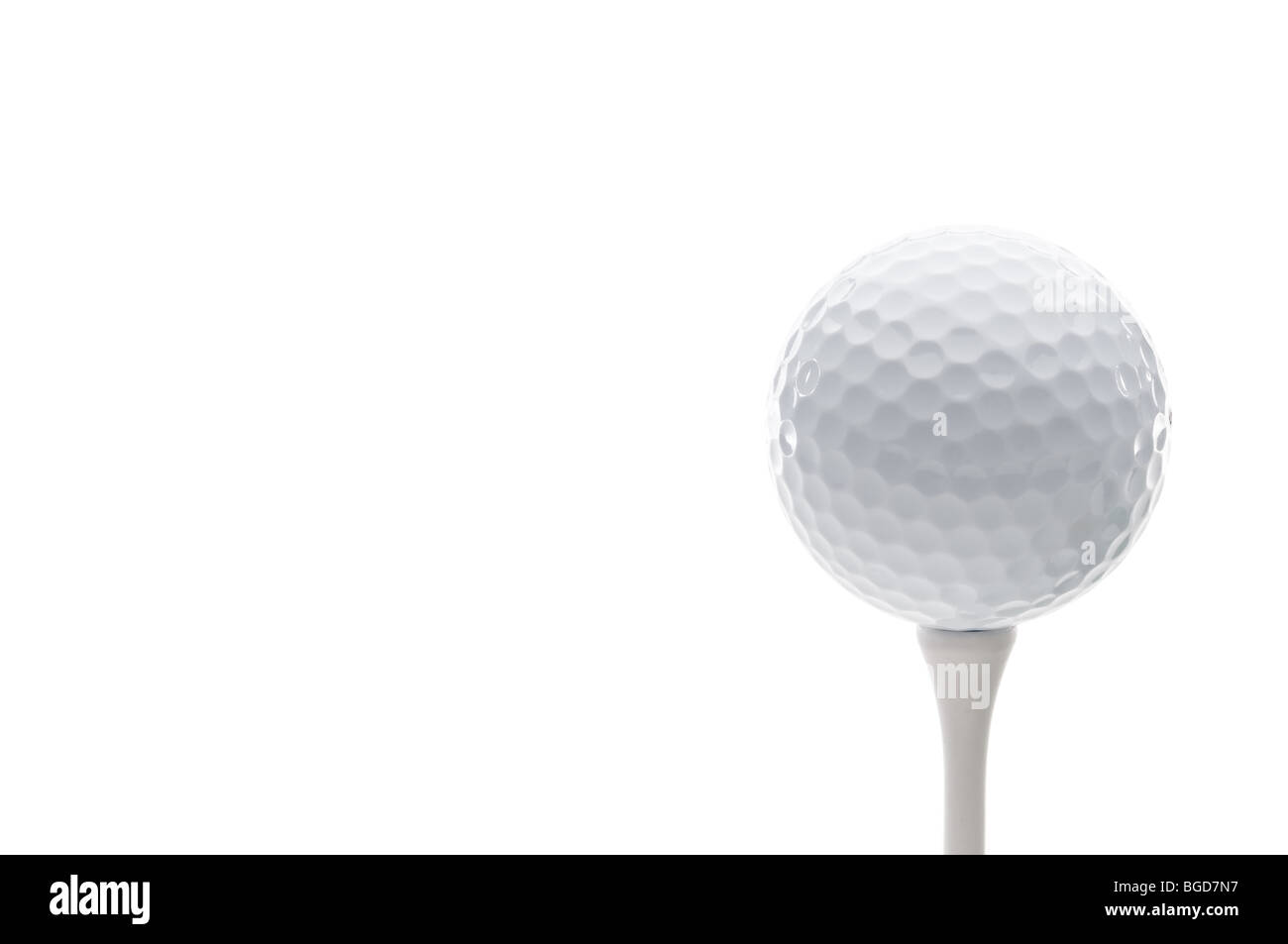 Horizontal close up of a golf ball on a tee Stock Photo