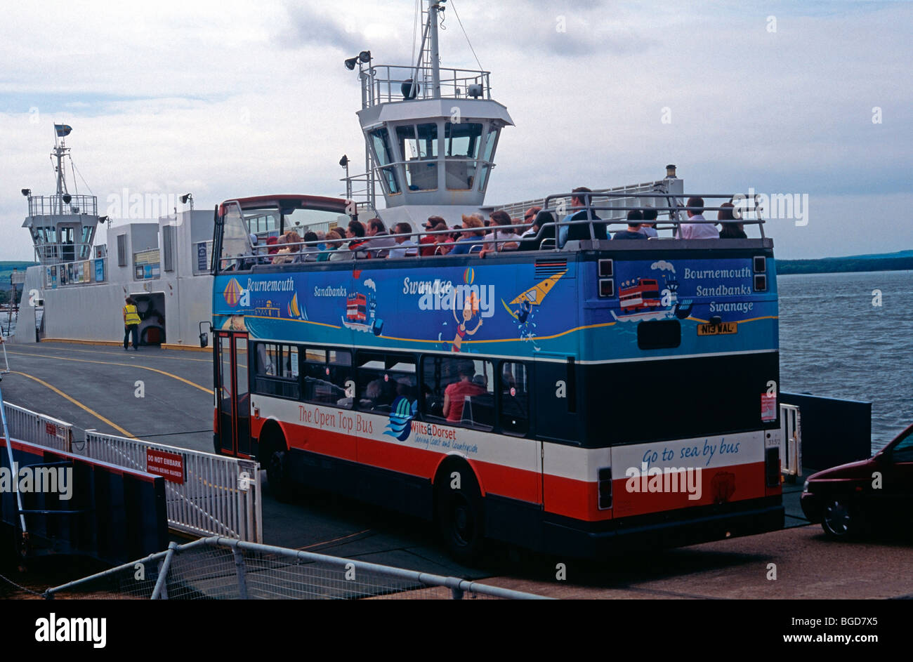 Open top bus boarding the chain ferry at Sandbanks, Dorset, en route to