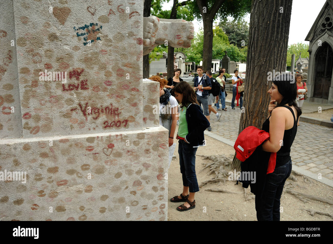 Tourists or Visitors & Lipstick Kisses on the Oscar Wilde Tomb, Pere Lachaise Cemetery, Paris, France Stock Photo