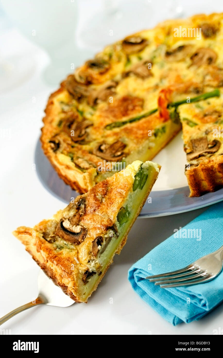Asparagus quiche with prawns and mushrooms. Recipe available. Stock Photo