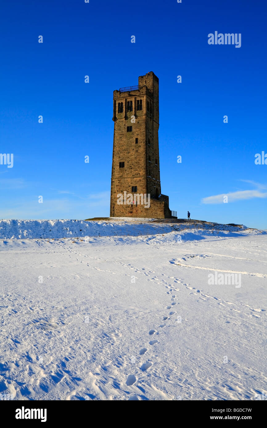 Solitary walker at Jubilee Tower, Castle Hill, Huddersfield, West Yorkshire, England, UK. Stock Photo