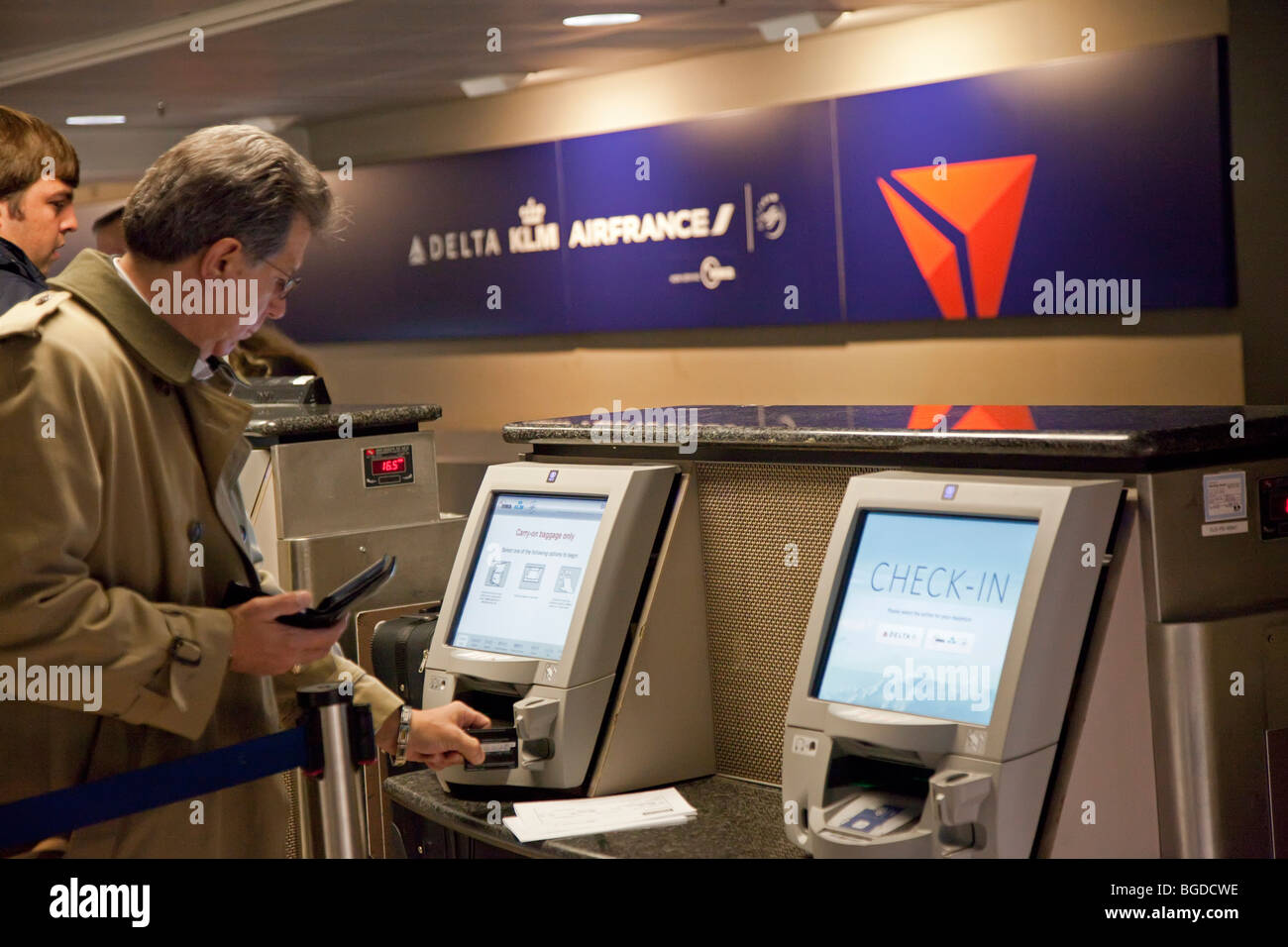 A passenger checks luggage at Detroit Metro Airport Stock Photo Alamy