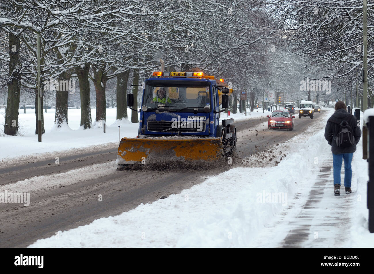 A snow plough clearing the pavements after heavy snow in Perth Stock Photo