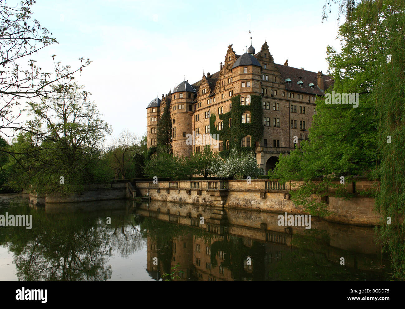 Neuenstein Castle, originally a moated castle of the Hohenstaufen period, location of the Hohenlohe Central Archives, Neuenstei Stock Photo