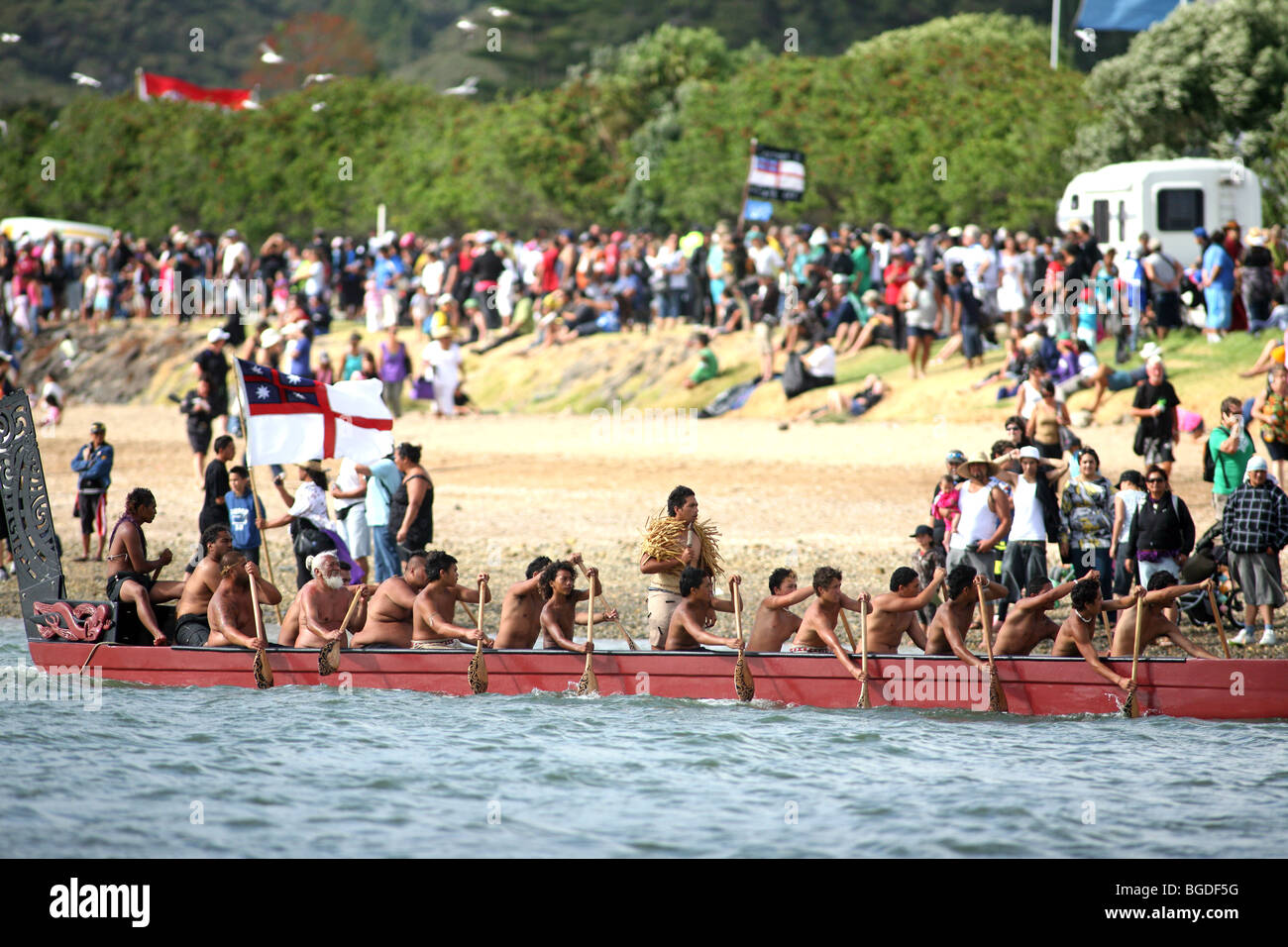 A Waka Taua (war canoe) on the Waitangi River during Waitangi Day celebrations. Waitangi, Northland, New Zealand Stock Photo