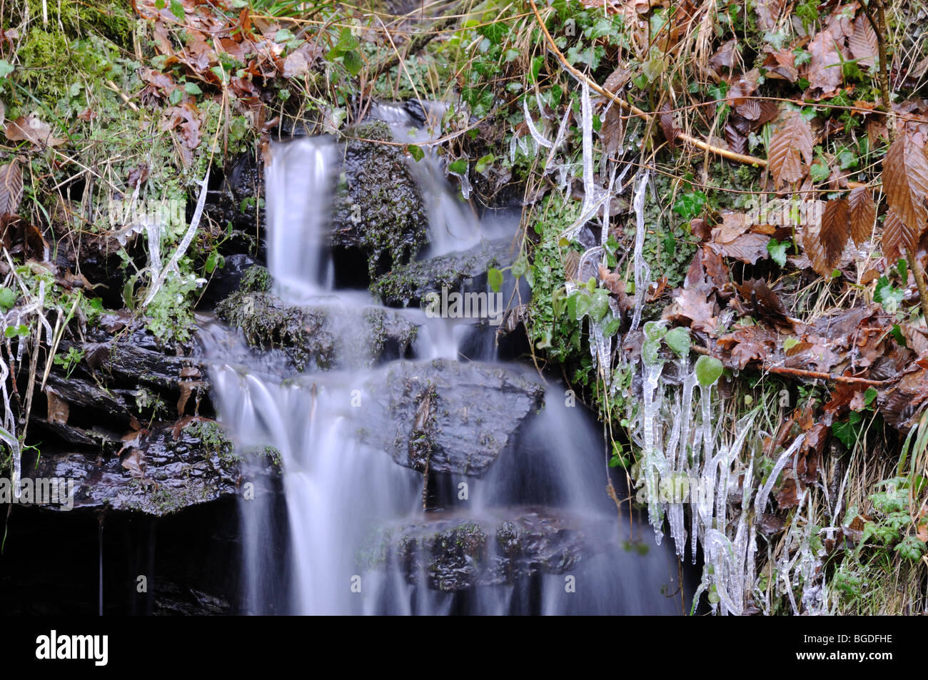 Small waterfall in winter landscape Stock Photo