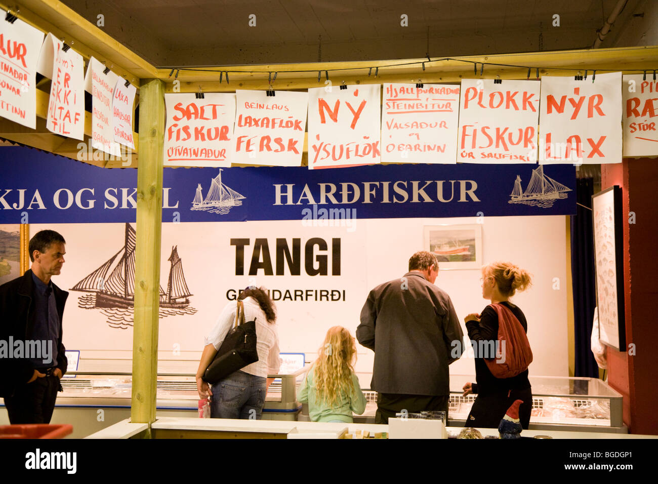 Shoppers buying fresh fish at Kolaportid flea market. Downtown