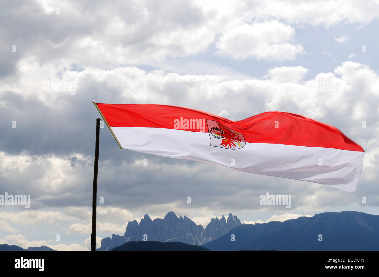 State flag fluttering over the Odle group, Dolomites, South Tyrolean eagle, South Tyrol, Italy, Europe Stock Photo