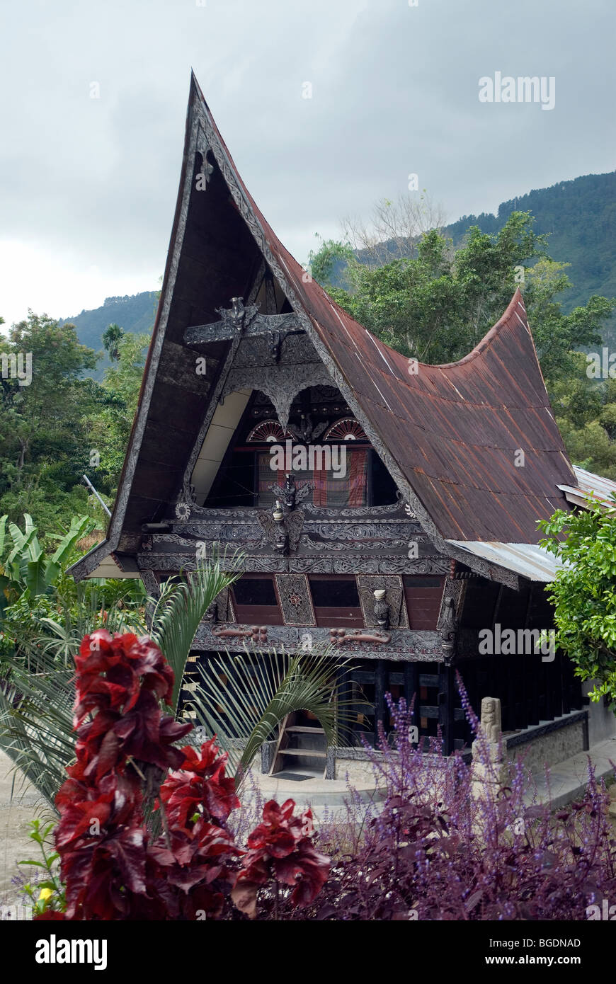 The characteristic sweeping prow-shaped roofs of Batak houses Stock Photo