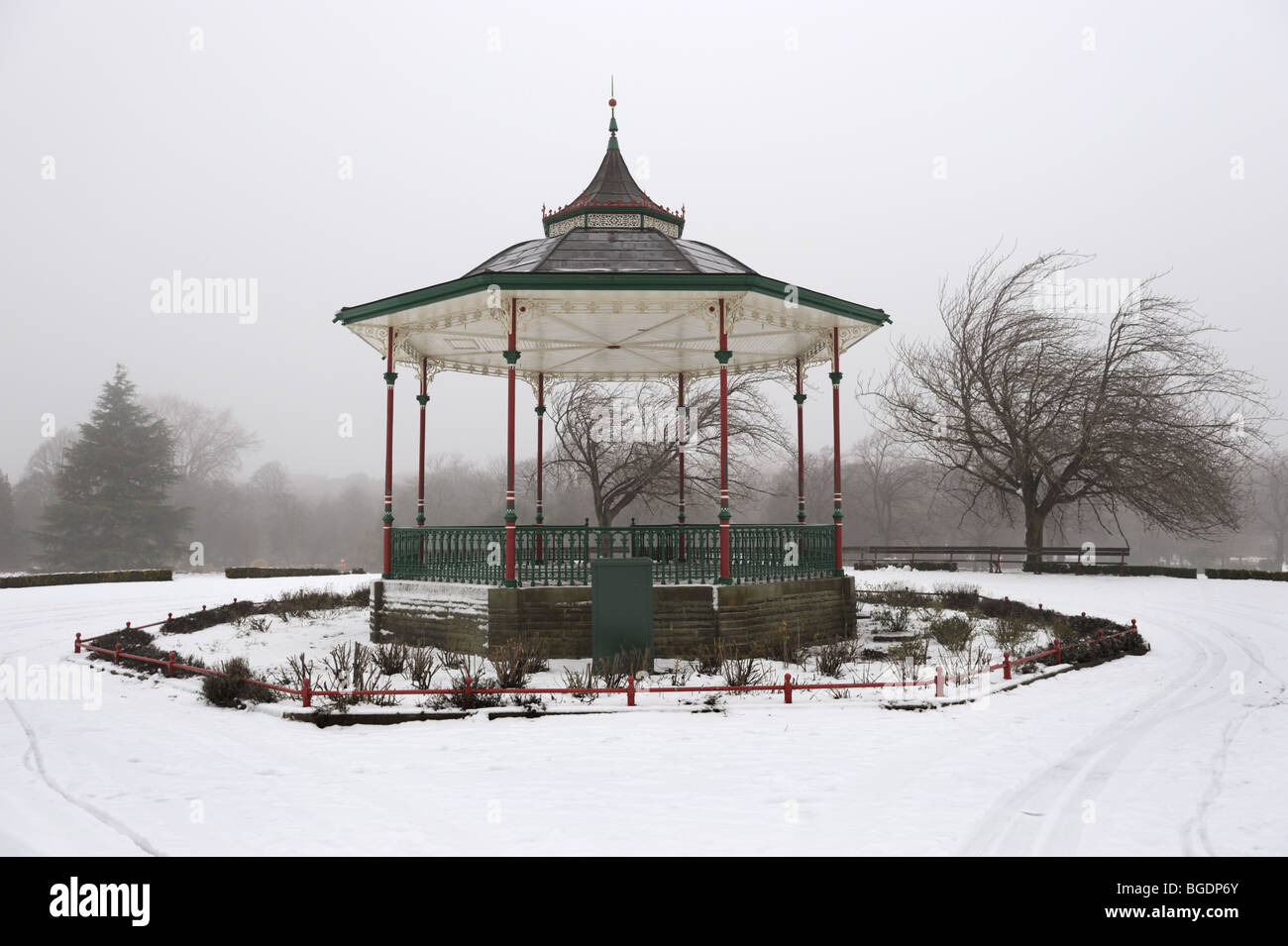 Late afternoon light on the snow on Christmas Eve 2009, around the bandstand at Queen's Park, Chesterfield, Derbyshire Stock Photo