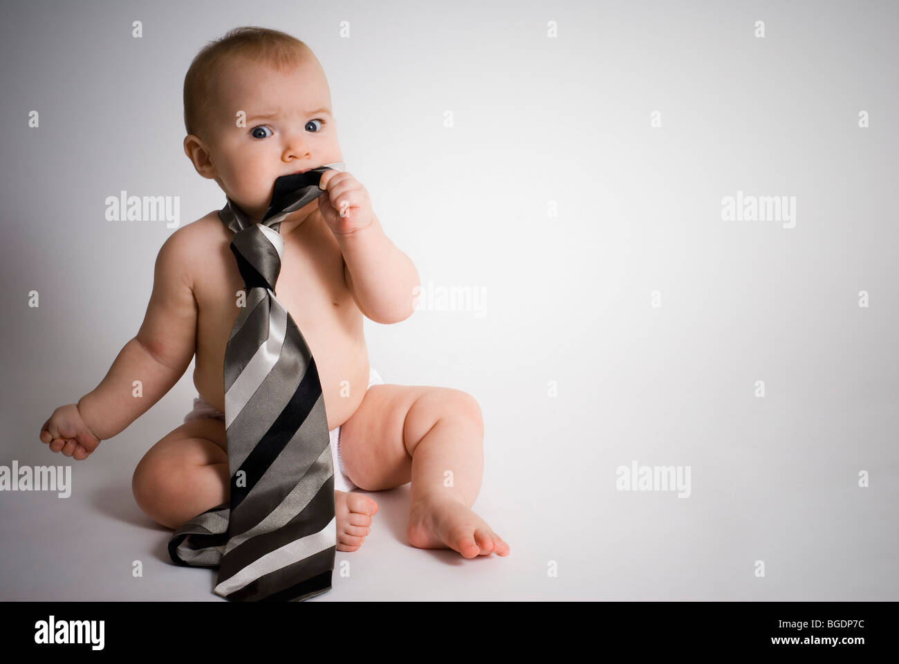 Baby wearing tie Stock Photo