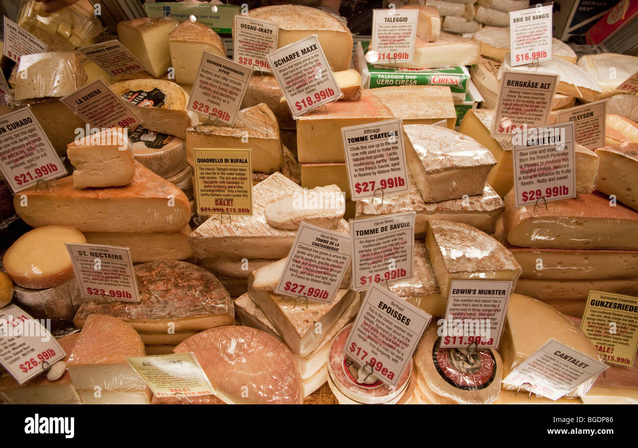 Cheeses on display in a food shop. Stock Photo