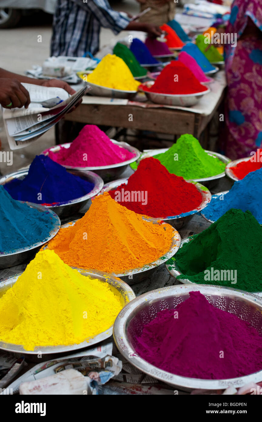 Coloured Indian powder in metal bowls used for making rangoli designs at festivals. Andhra Pradesh, India Stock Photo