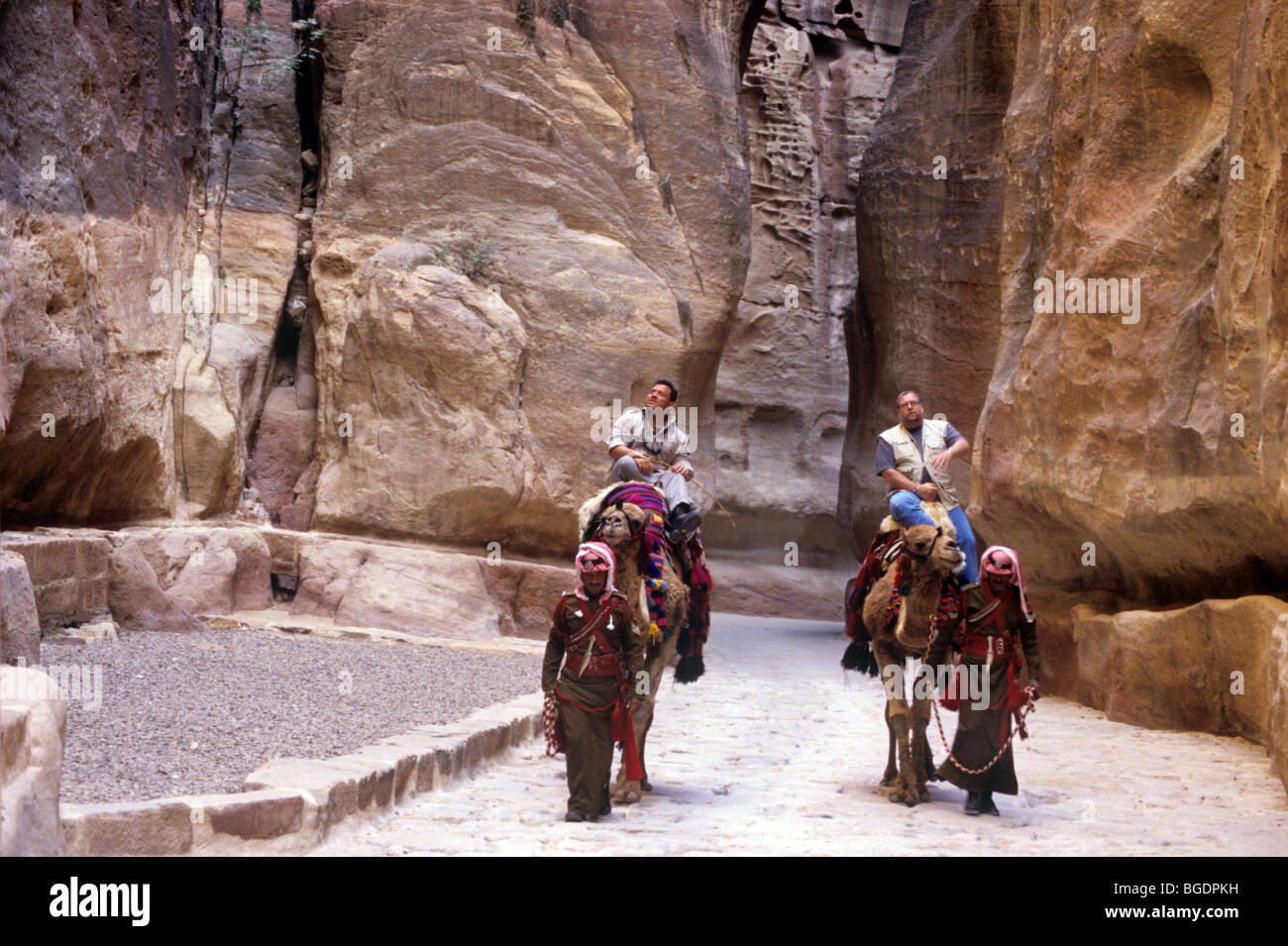 King Abdullah II tours Petra  on camel back with a friend Stock Photo