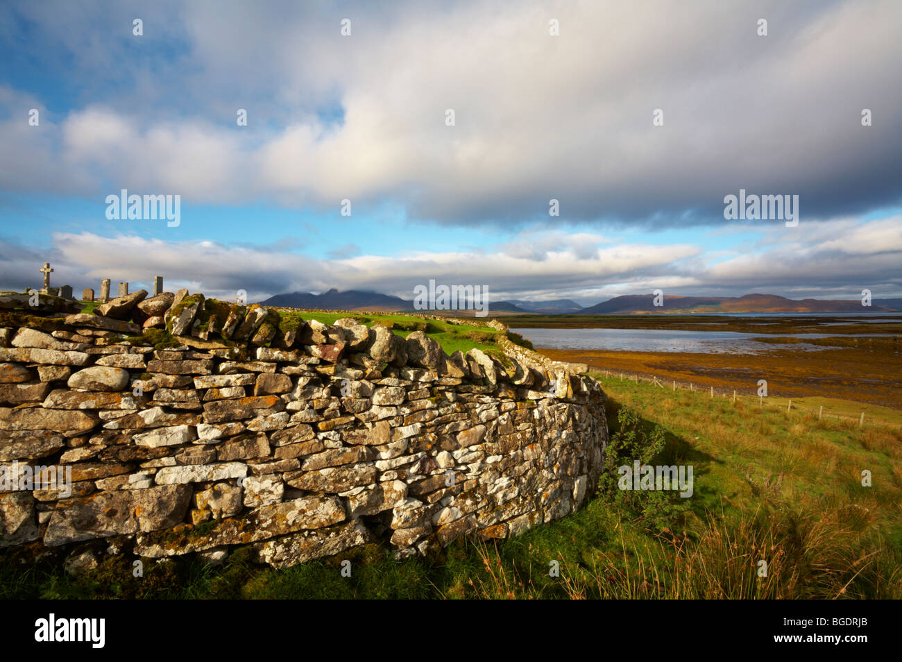 Scotland Inner Hebrides Isle of Skye Broadford Graveyard at Lower Breakish looking towards Scalpay Isle of Raasay far distant. Stock Photo