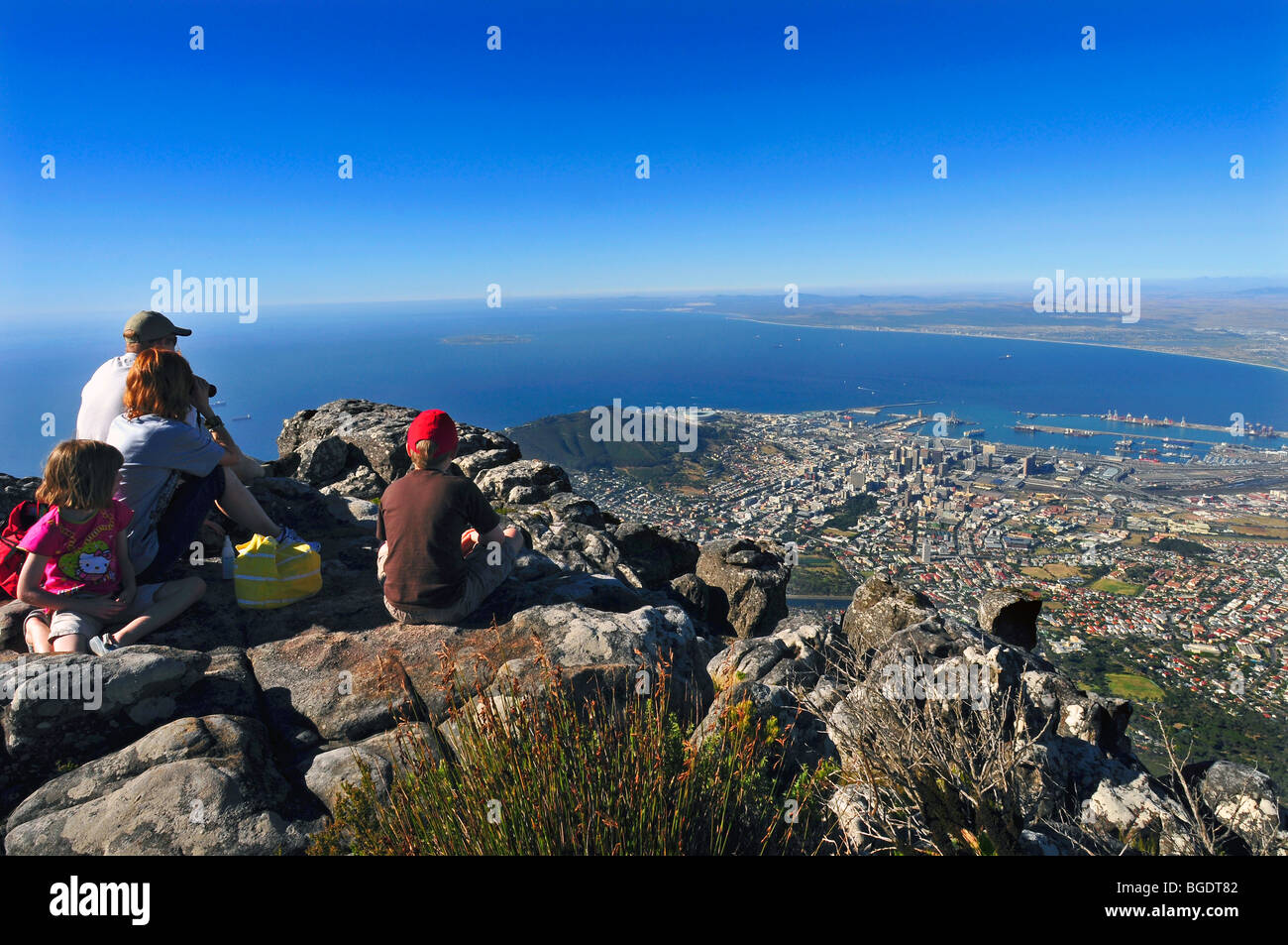 A family admiring the view of cape town from the top of table mountain in south africa Stock Photo