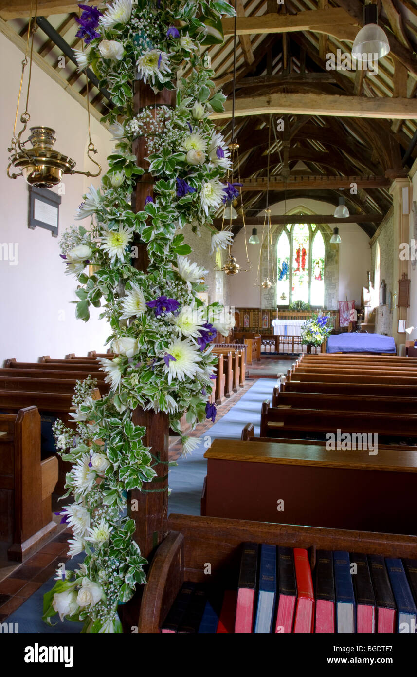 Floral adornments at the beginning of the Nave in the village church of St James in Cardington,Shropshire,England. Stock Photo