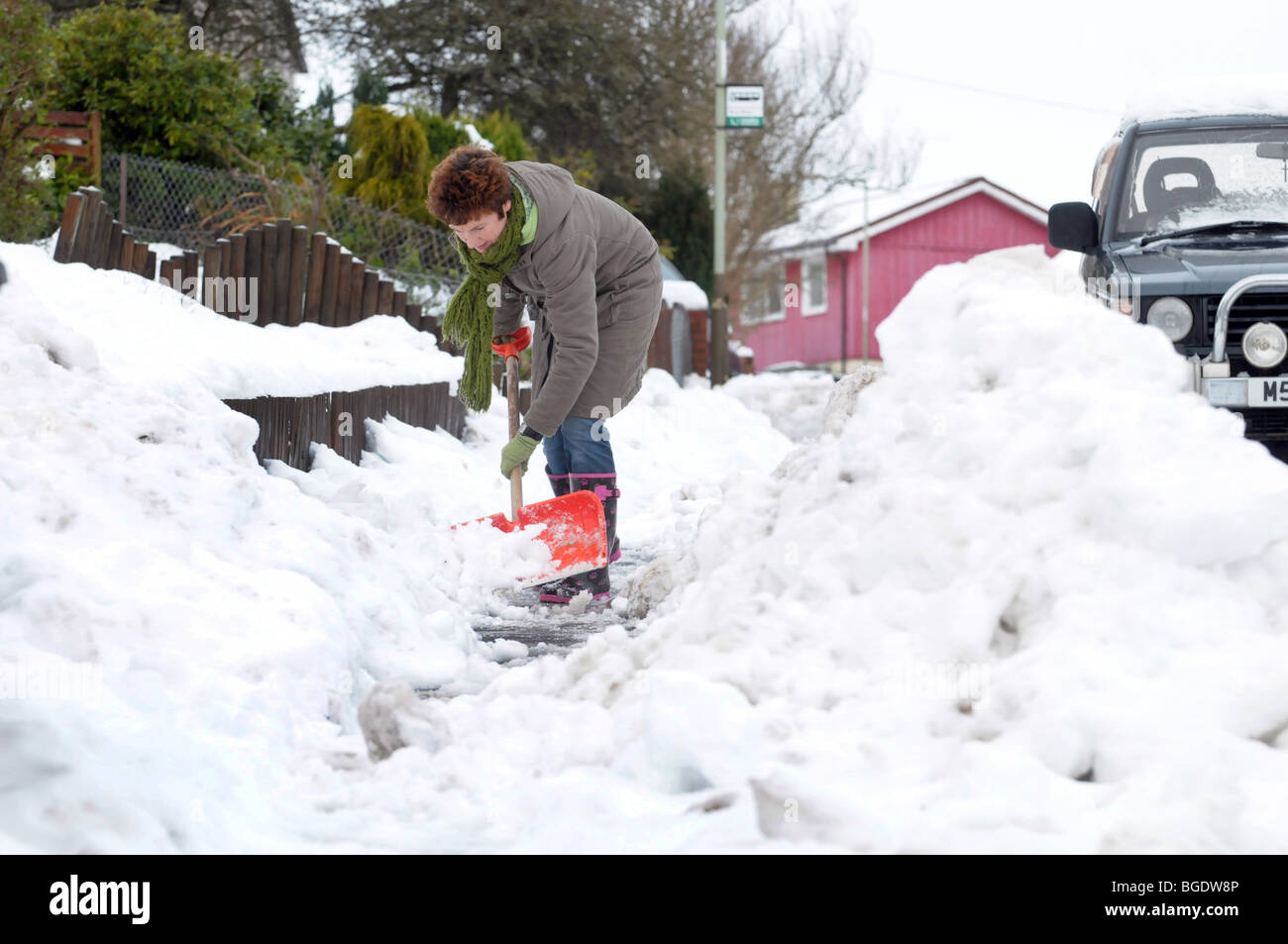 Woman Clearing Path Of Snow High Resolution Stock Photography and ...