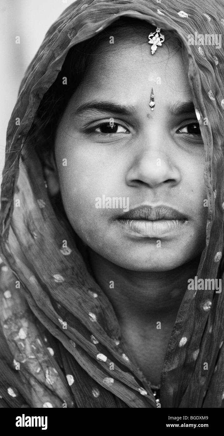 Indian girl wearing a white shawl. Monochrome Stock Photo