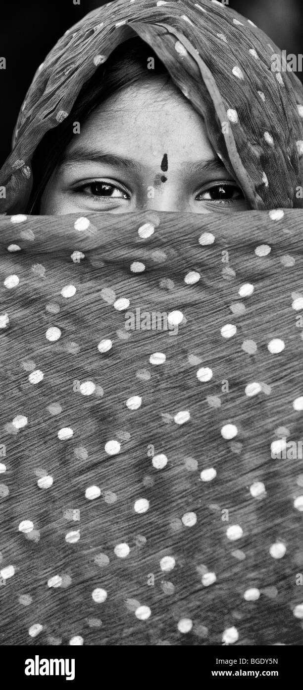 Smiling happy Indian girl wearing a shawl. Monochrome Stock Photo