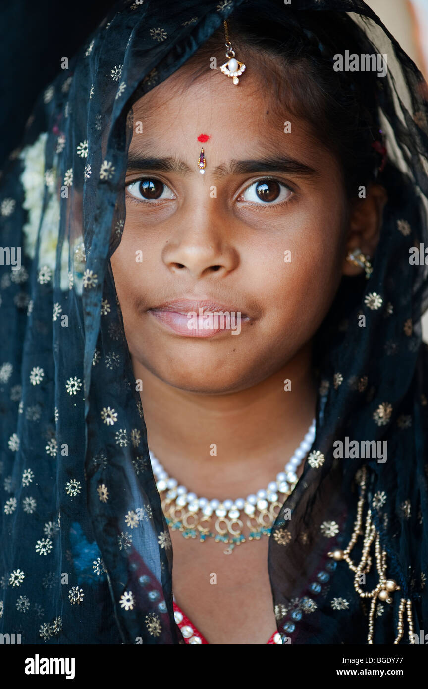 Happy Indian girl wearing a black shawl. Andhra Pradesh, India Stock Photo