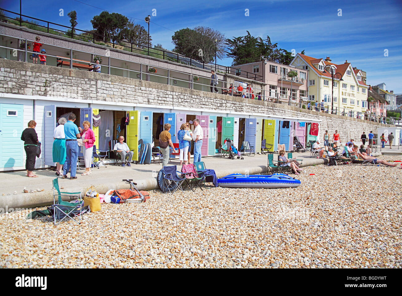 Colourful beach huts on the sea front at Lyme Regis, Dorset, England