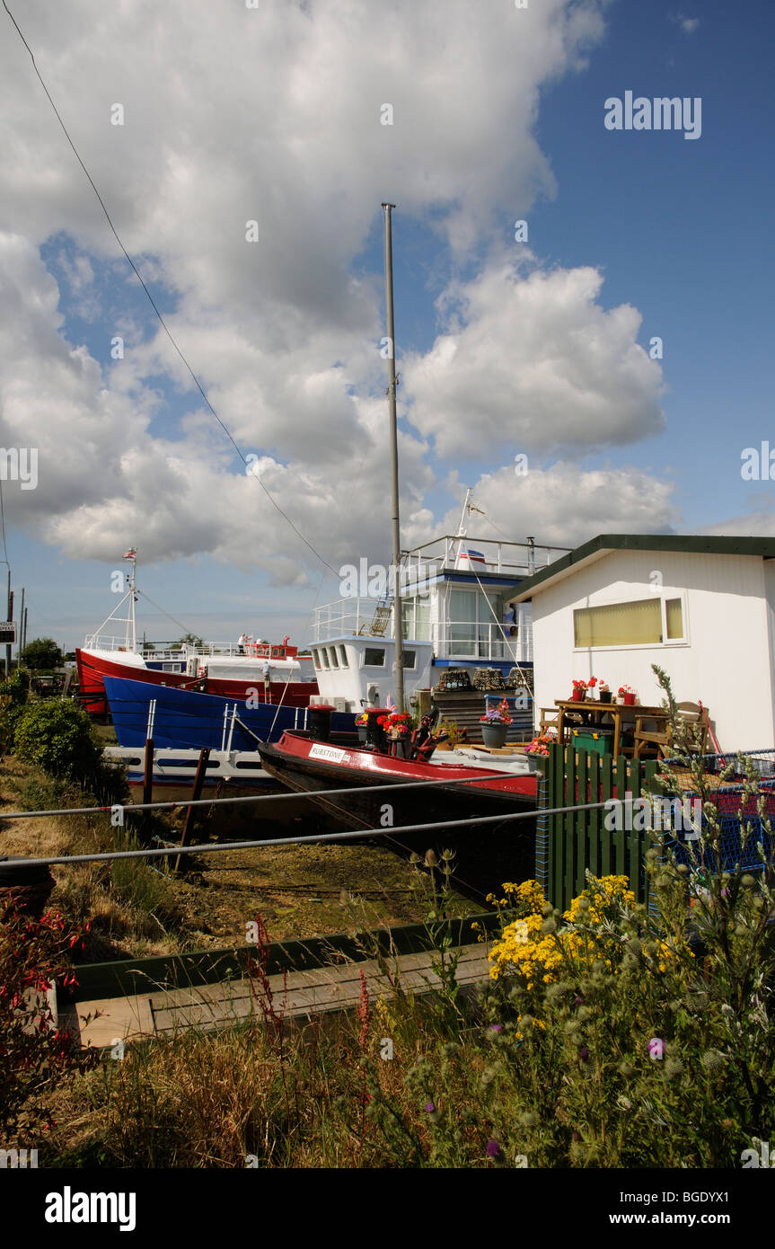 Houseboats on the shoreline at Bembridge Harbour Isle of Wight southern