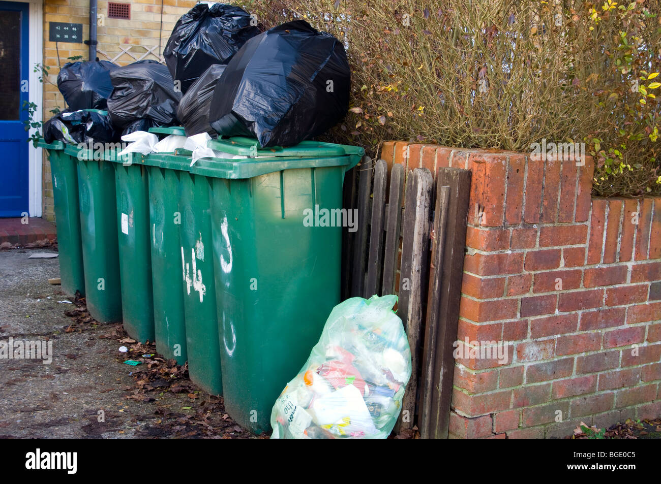 Overflowing Household Waste Bins Stock Photo - Alamy