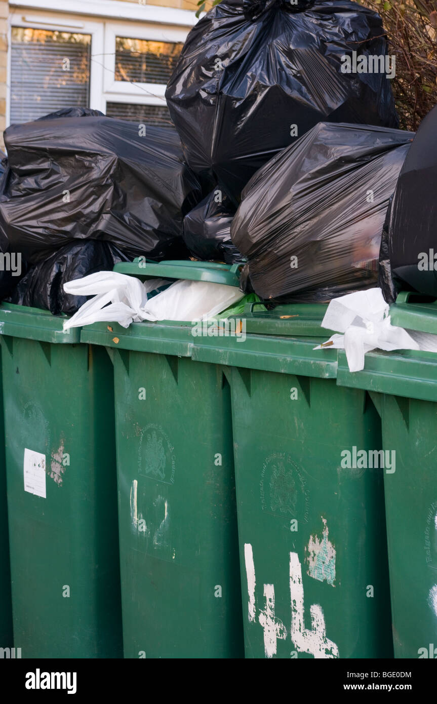 Overflowing Household Waste Bins Stock Photo - Alamy
