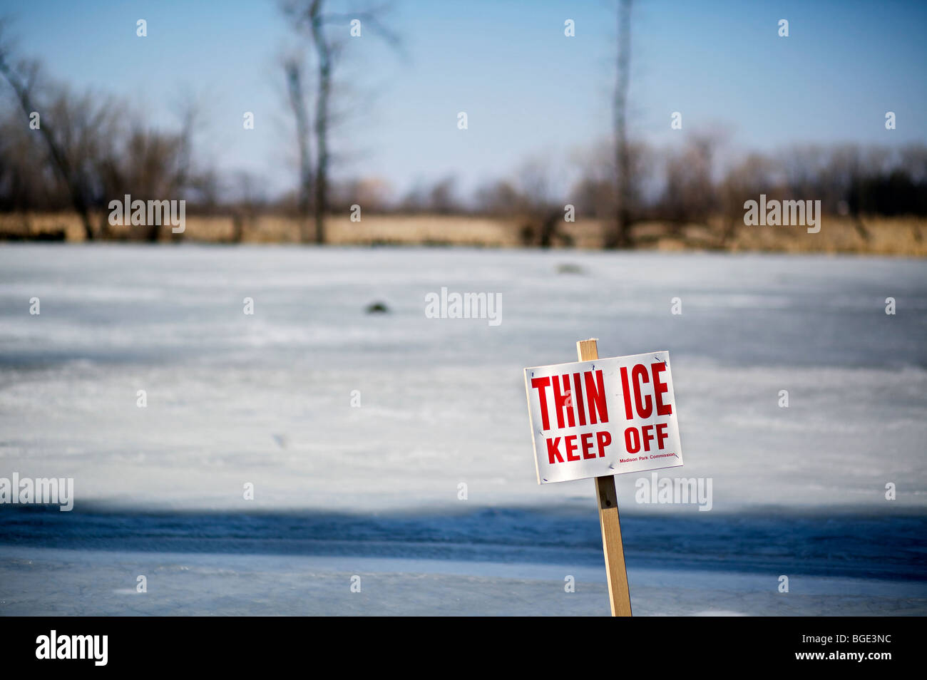Thin ice sign on pond in Madison, Wisconsin. Stock Photo