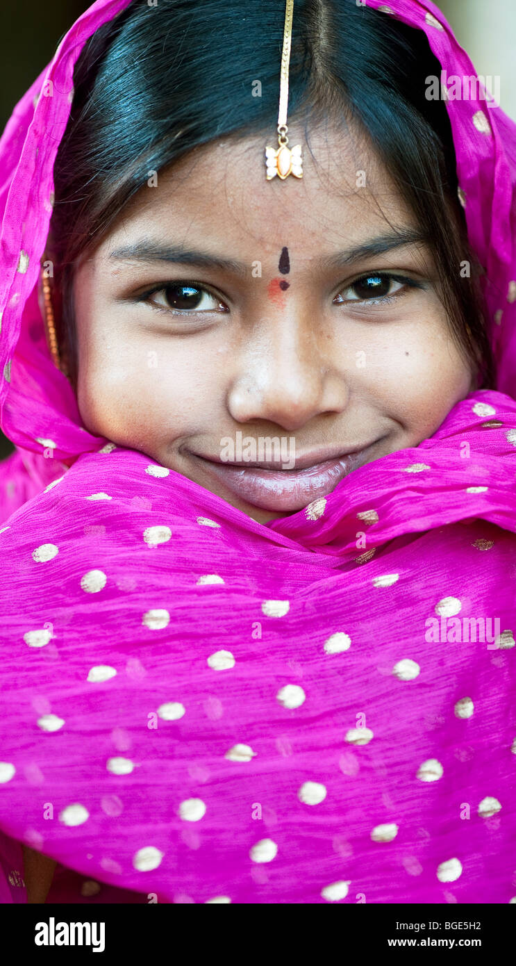 Smiling happy Indian girl wearing a pink shawl. Andhra Pradesh, India Stock Photo