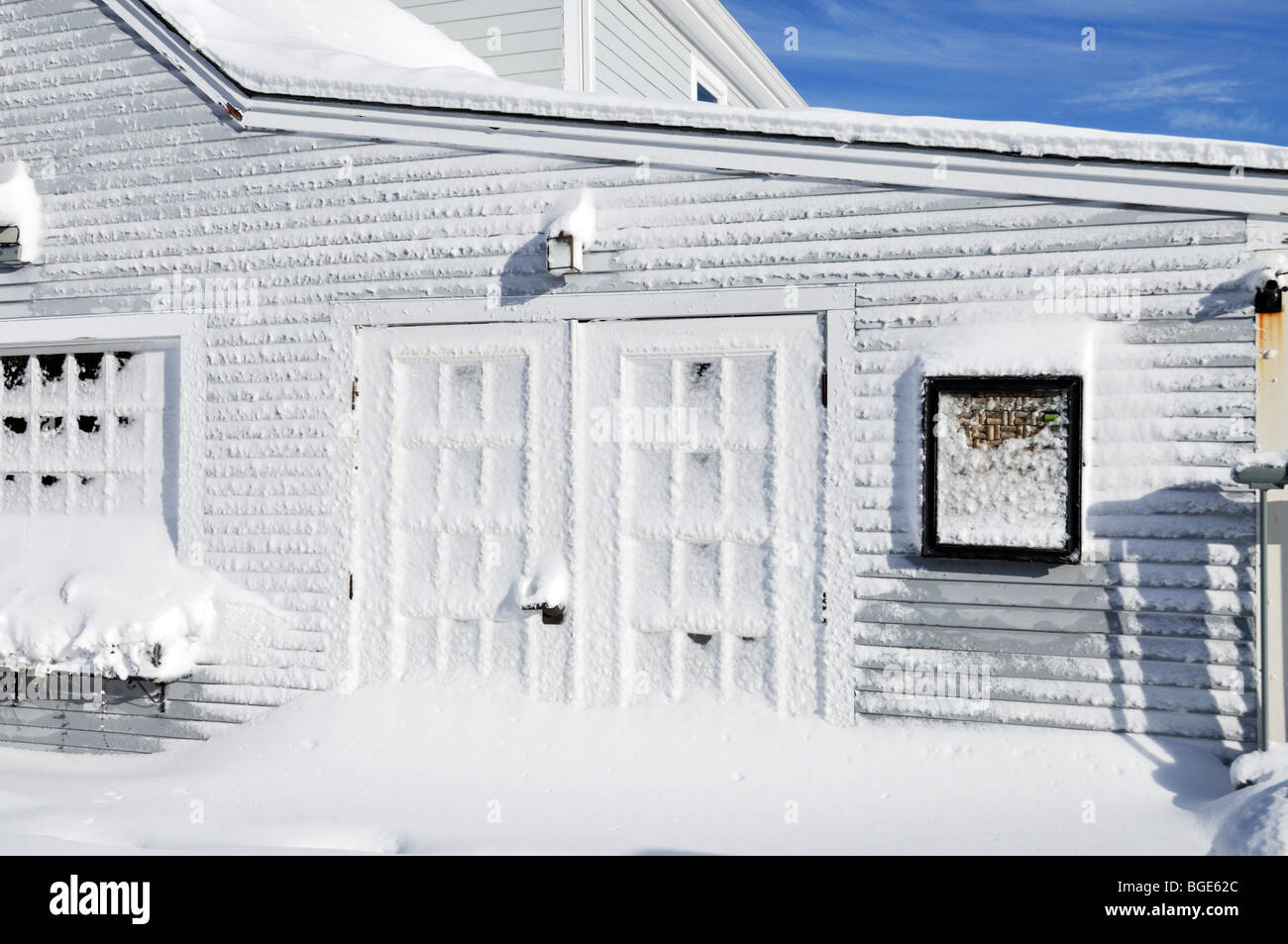 Heavy fresh snowfall on building in Woods Hole, Falmouth Cape Cod Stock Photo