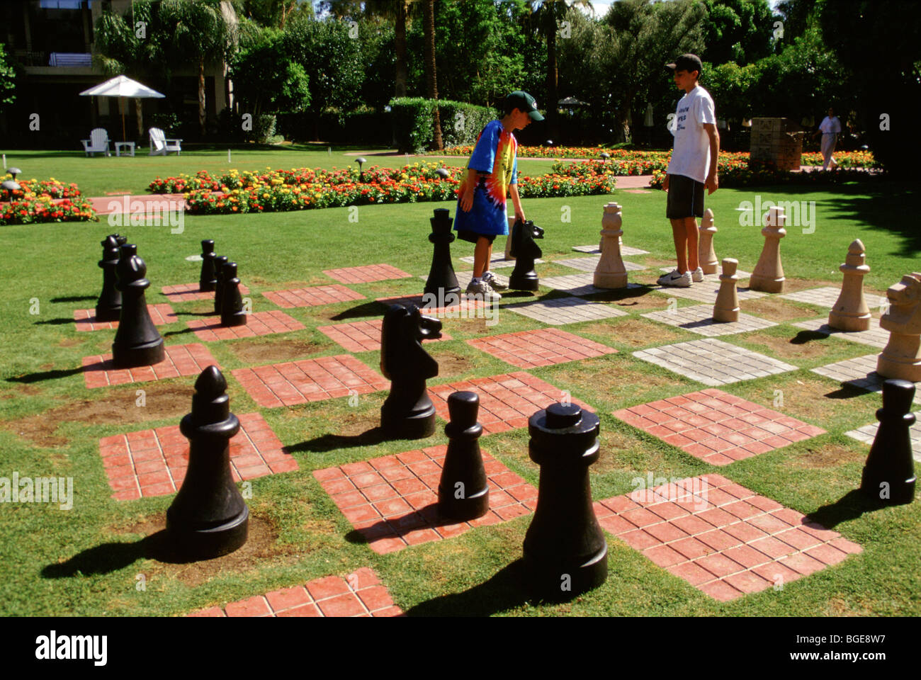 Children play chess on a giant board in the gardens of a 5 star hotel in  Arizona, USA Stock Photo - Alamy