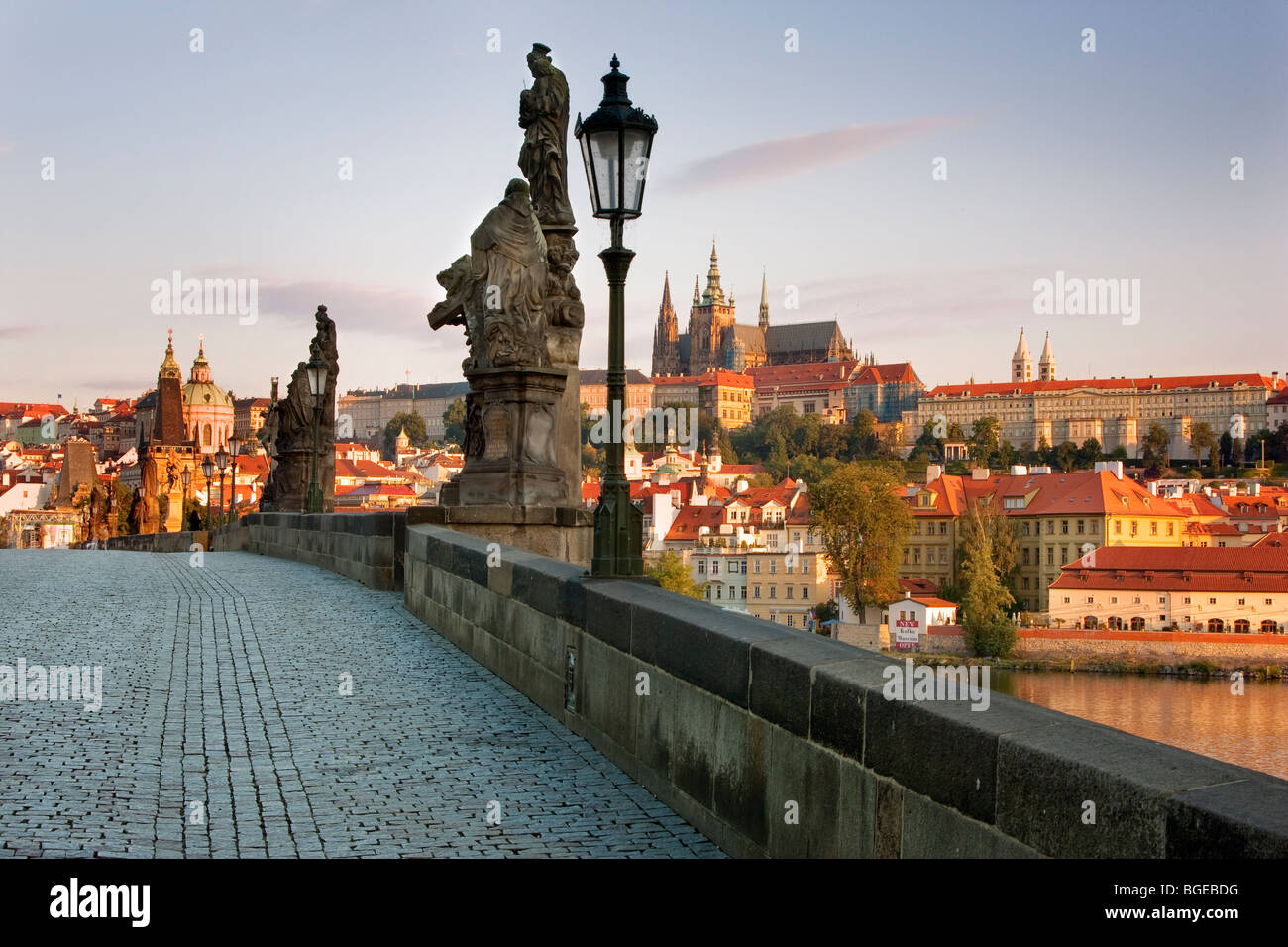 View of Charles' Bridge by Vltava River with Prague Castle in the distance. Shot in Prague, Czech Republic. Stock Photo