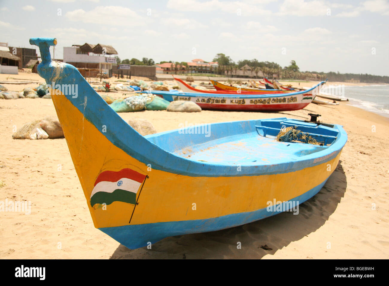 Fishing boats stand on the beach at Mahabalipuram, India. The fleet was badly damaged in the Asian Tsunami of 2004. Stock Photo
