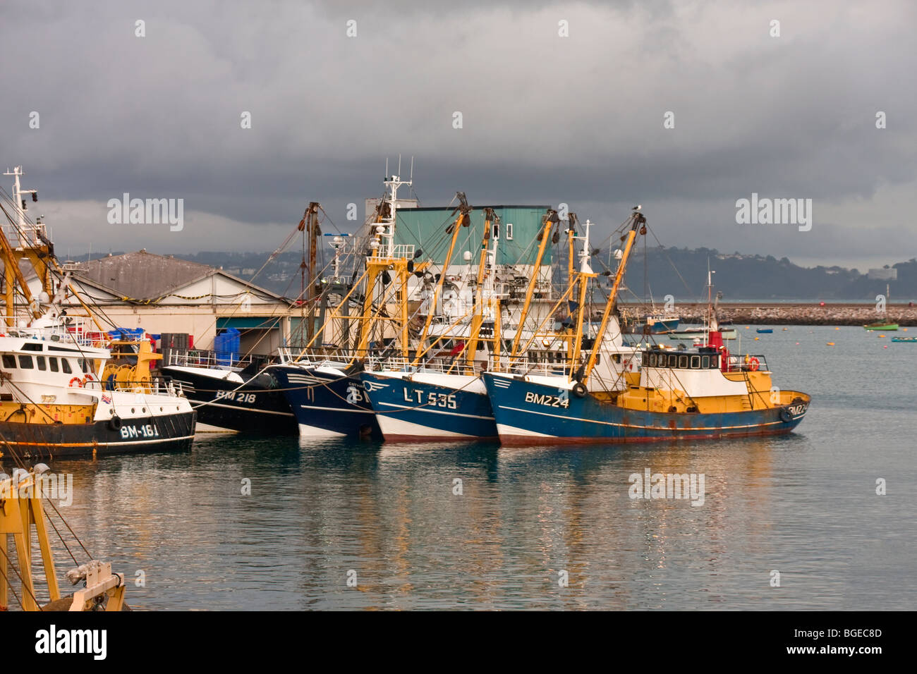 Fishing trawlers moored up in 'Brixham harbour' Stock Photo