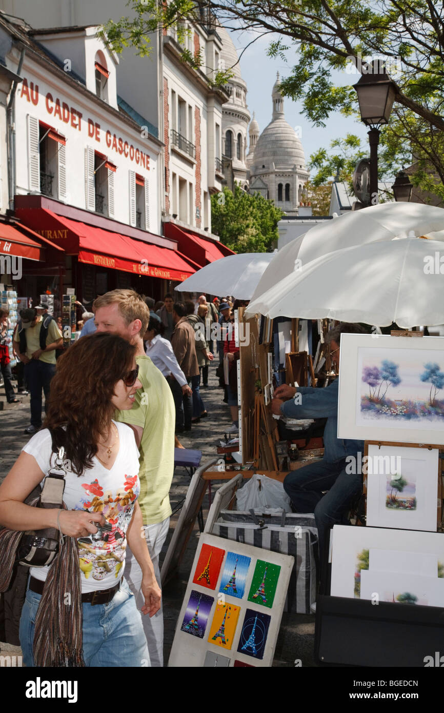Tourists browse artist stalls at Place du Tertre in Montmartre, Paris, France Stock Photo