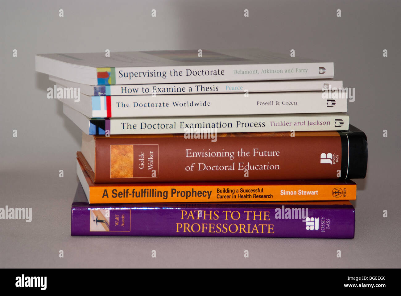 University textbooks on a light coloured plain background Stock Photo Alamy