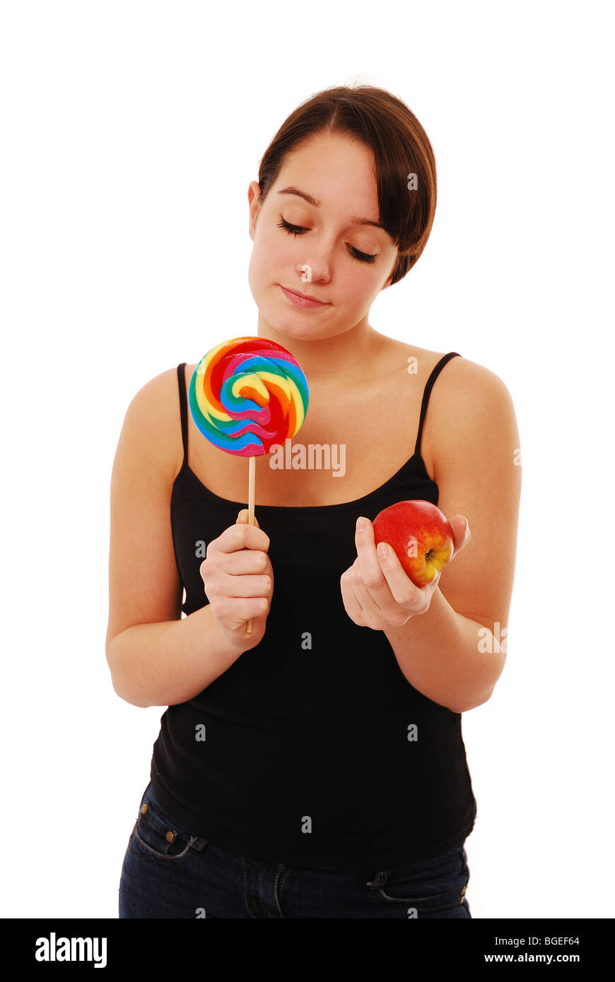 Young woman deciding which food good  or bad Stock Photo