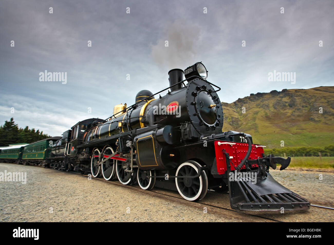 Kingston Flyer, a steam train built in 1925, pulling out of the Fairlight Station in Central Otago, South Island, New Zealand. Stock Photo