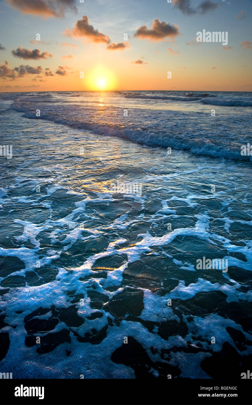 Beach With Waves & Surf Foam At Sunrise, Hilton Head Island, USA Stock Photo