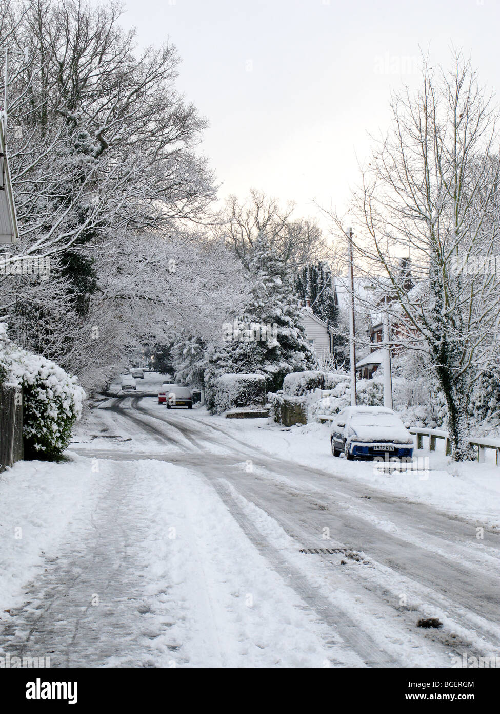 A road covered in snow with abandoned/parked cars Stock Photo - Alamy