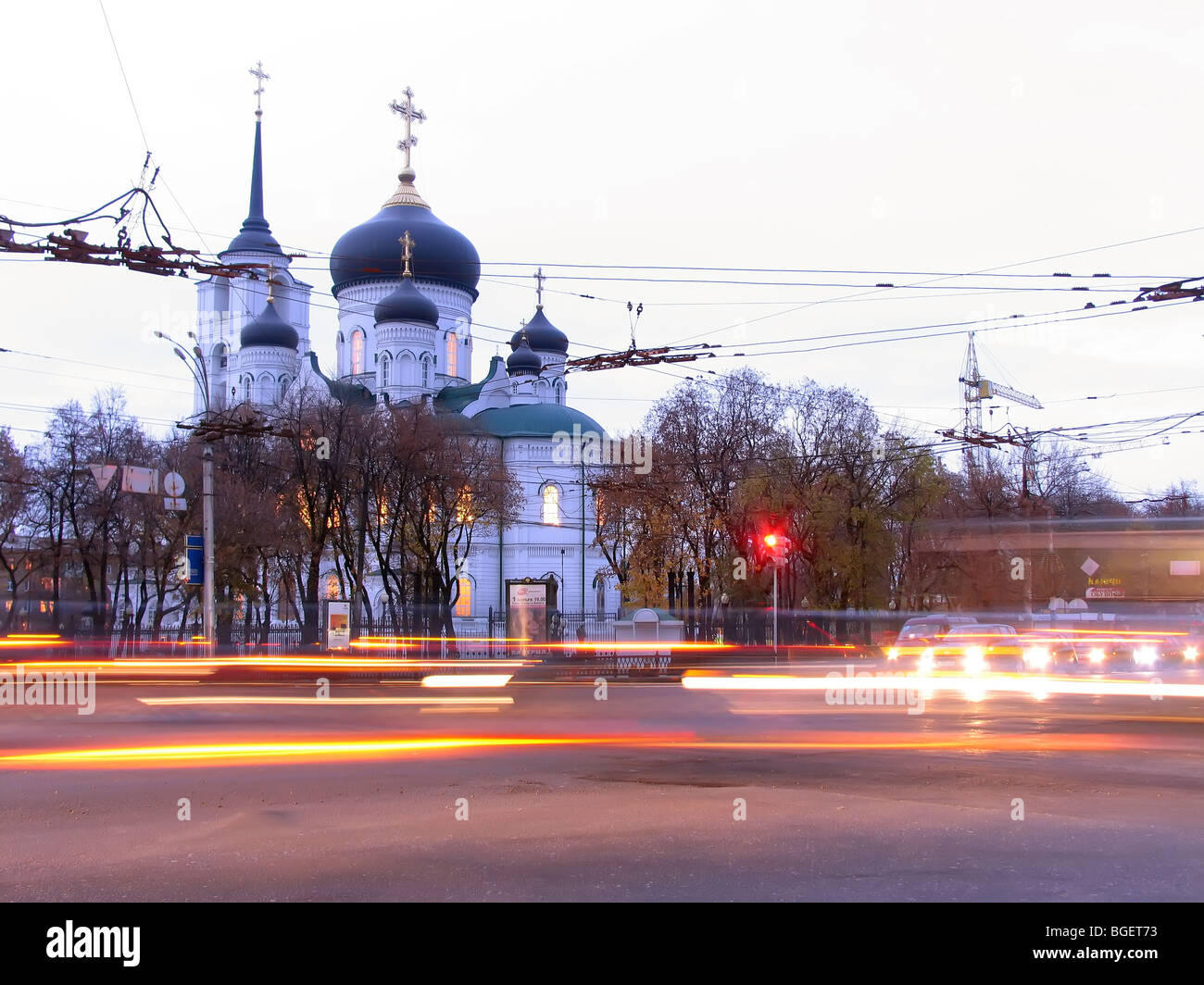 Moving traffic lights and Orthodox Cathedral of the Annunciation  in early evening, Voronezh, Russia Stock Photo